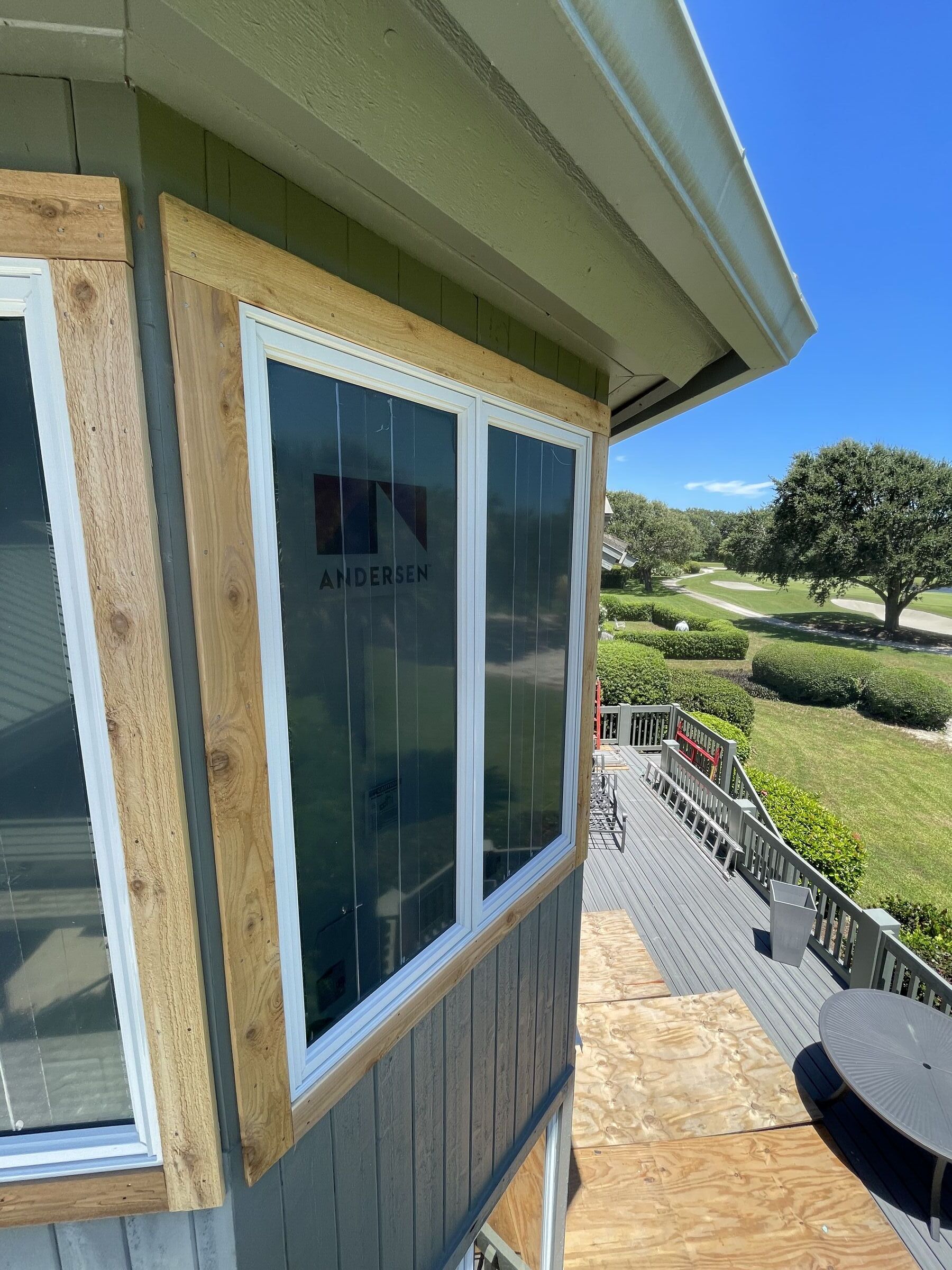 Andersen window installation on hillside residence