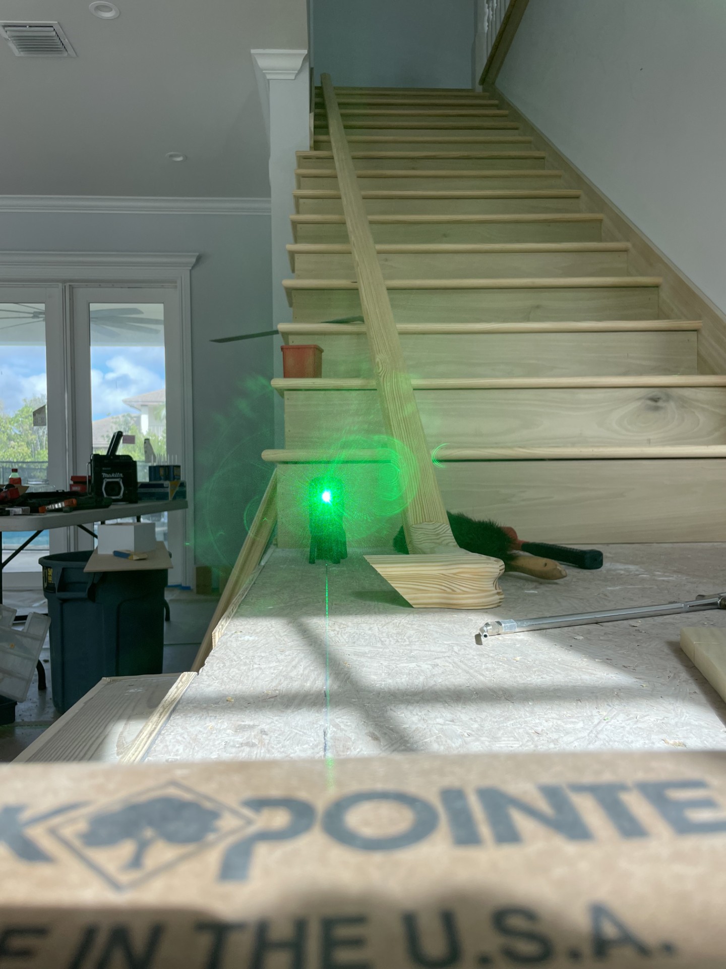 Staircase build in progress — laser level precision